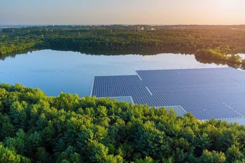 Aerial view of high-efficiency Floating Solar Photovoltaic Farm on water reservoir